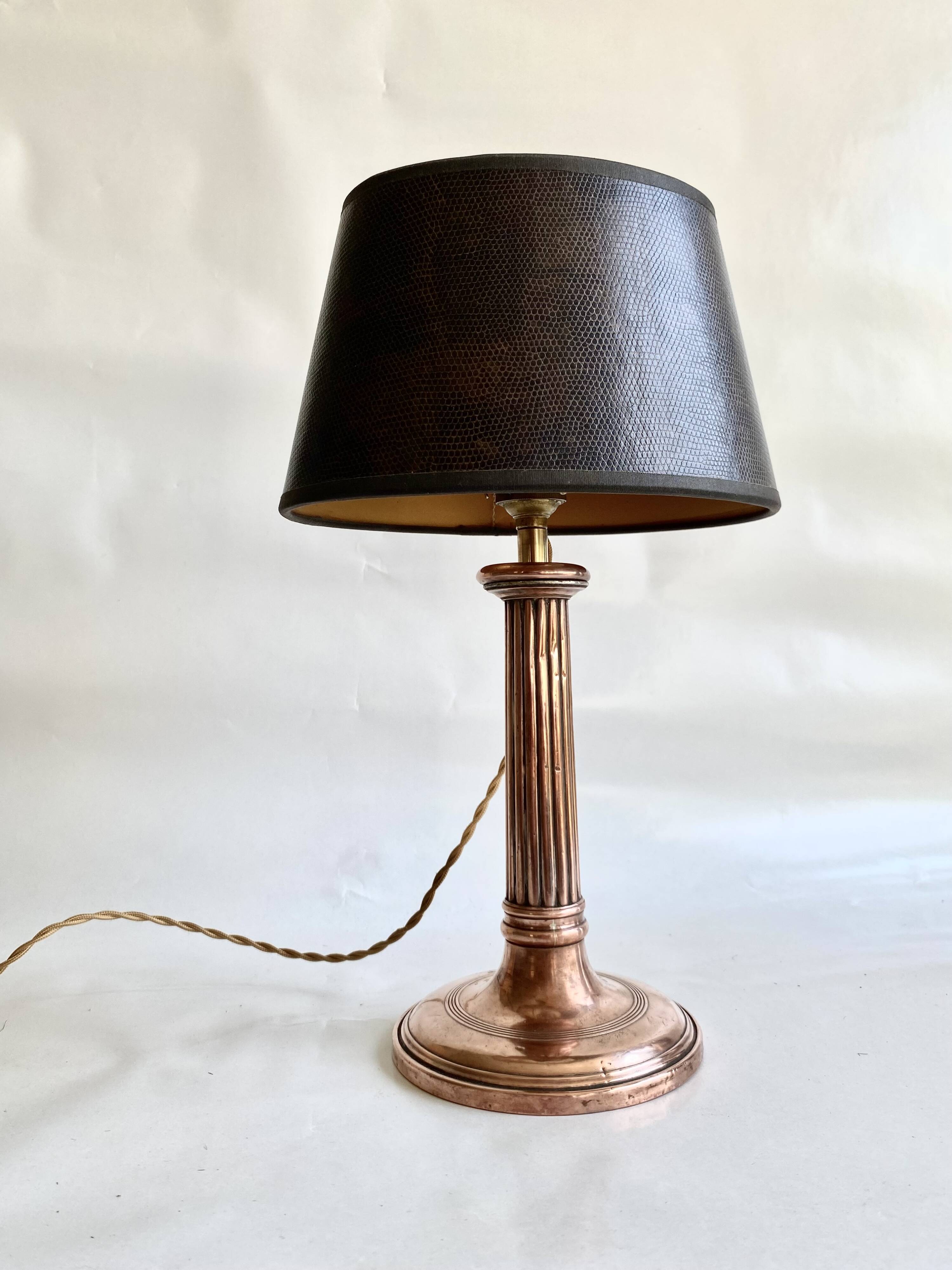 Copper lamp, fabric cable, sewn lampshade and leather.