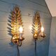 Pair of gold metal wall sconces in Hollywood Regency style, 1970s.