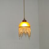 Vintage French amber mottled glass hanging ceiling light with beaded fringe.