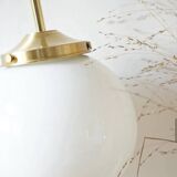 A pair of white opaline and brass suspensions.