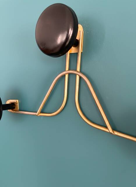 Golden brass coat rack with 3 black vintage hooks from the Mid Century 1950-60.