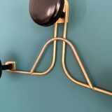 Golden brass coat rack with 3 black vintage hooks from the Mid Century 1950-60.