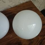Pair of spherical lampshades in opaline.