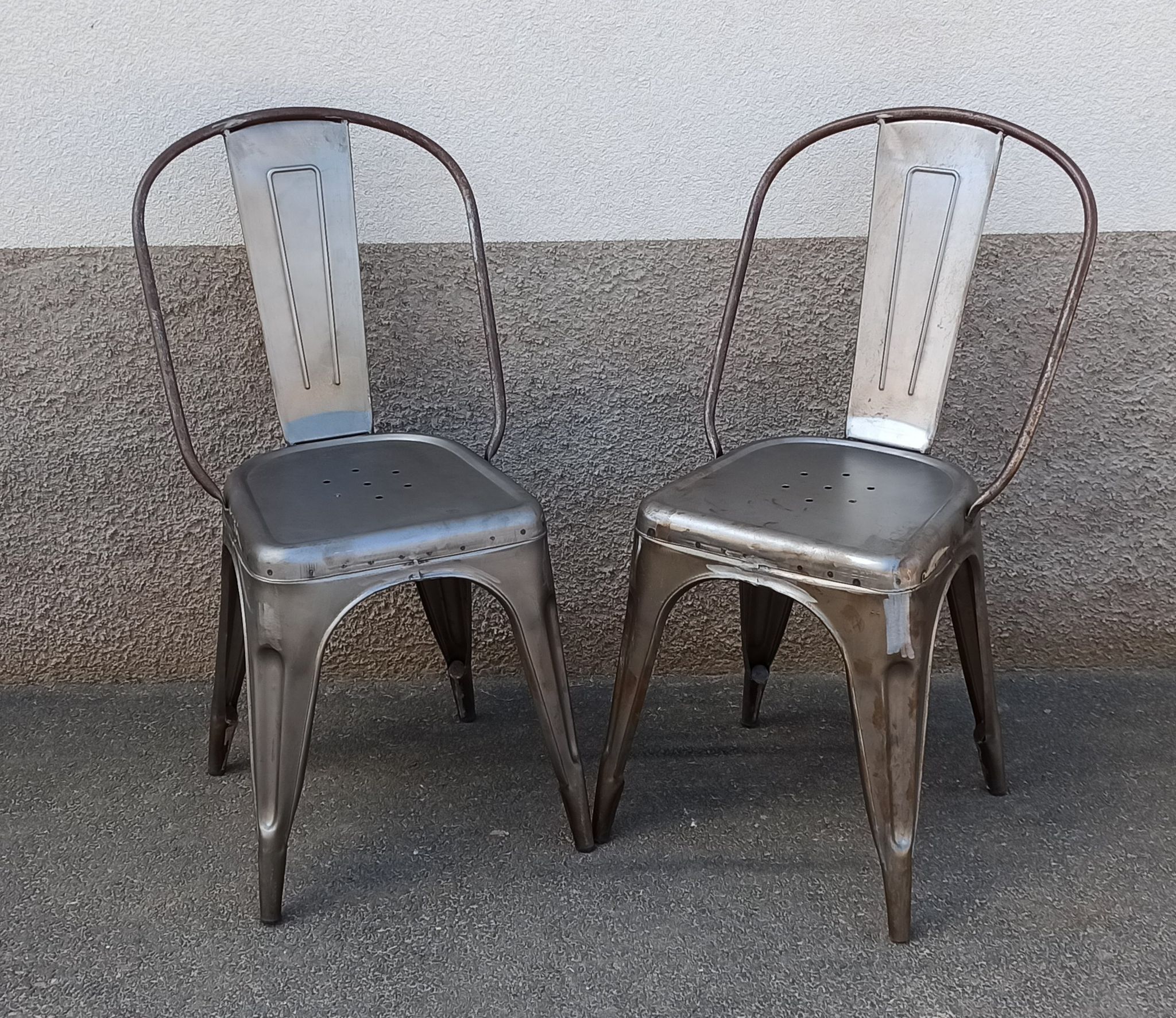 Pair of grey metal chairs