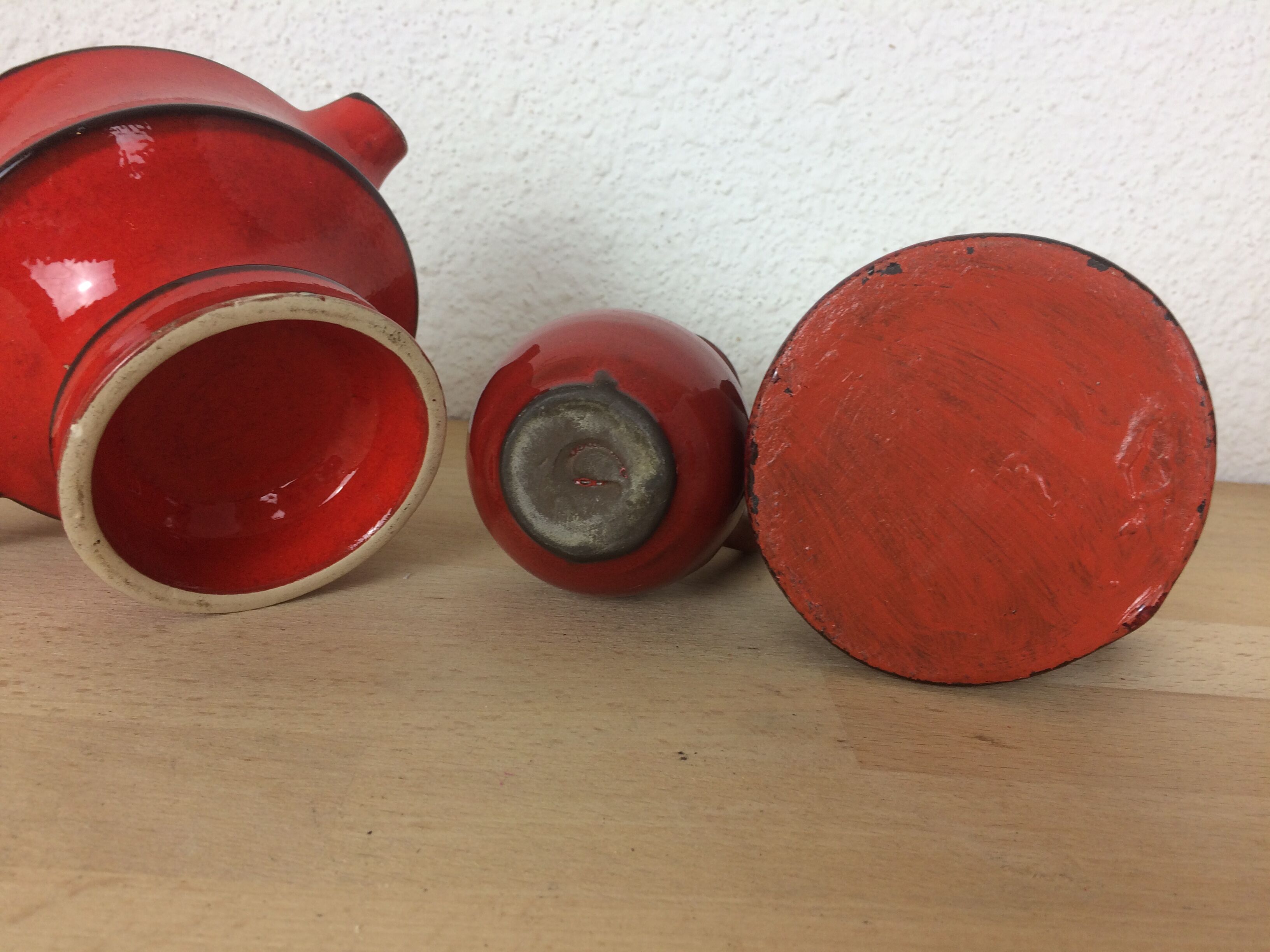 3 red ceramic vases
