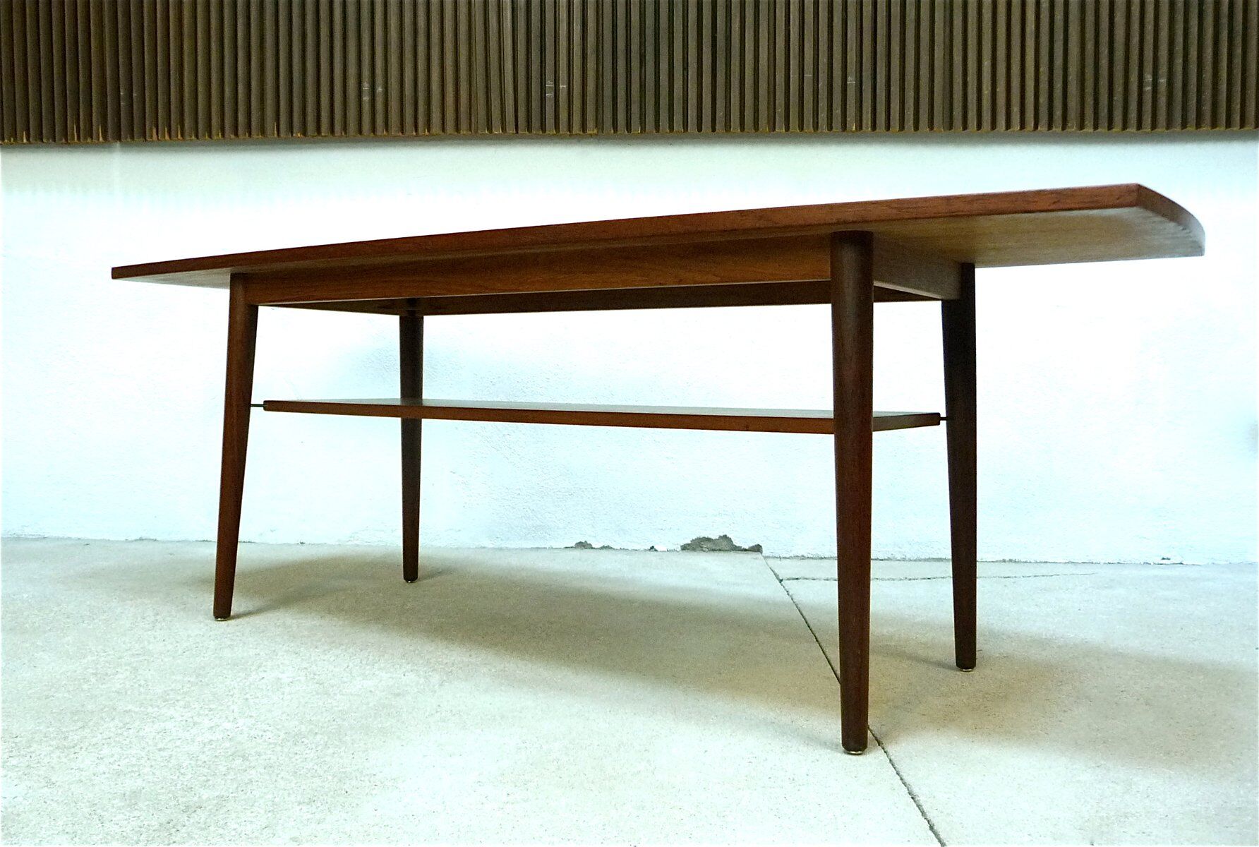Curved Danish teak coffee table with additional shelf compartment, 1960s