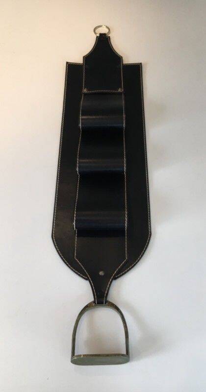 Leather wall-mounted magazine rack. Attributed to Jacques Adnet