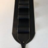 Leather wall-mounted magazine rack. Attributed to Jacques Adnet