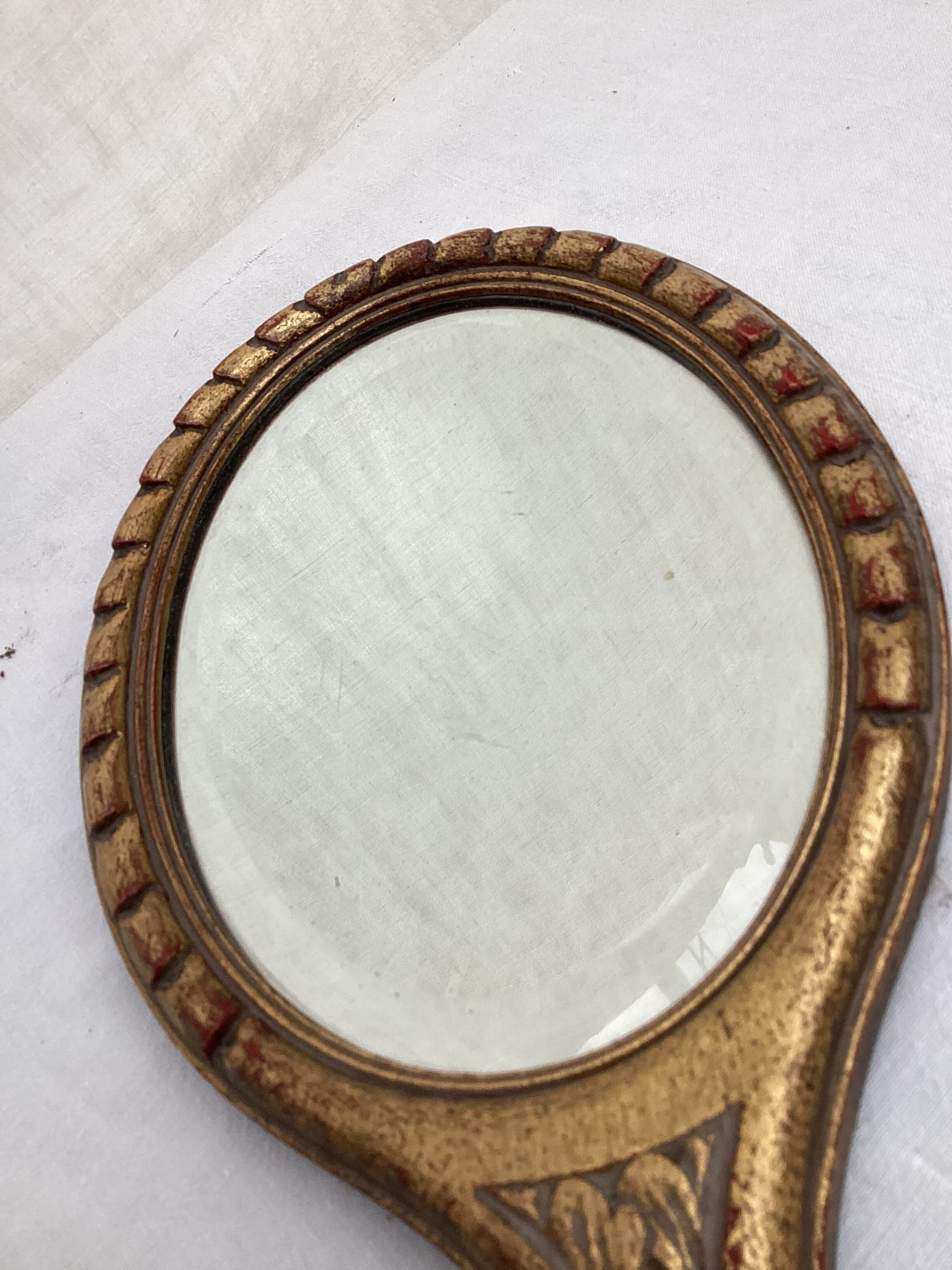 Hand-facing beveled mirror surrounded by wood dimension: height -38cm- width -15.5cm-