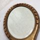 Hand-facing beveled mirror surrounded by wood dimension: height -38cm- width -15.5cm-