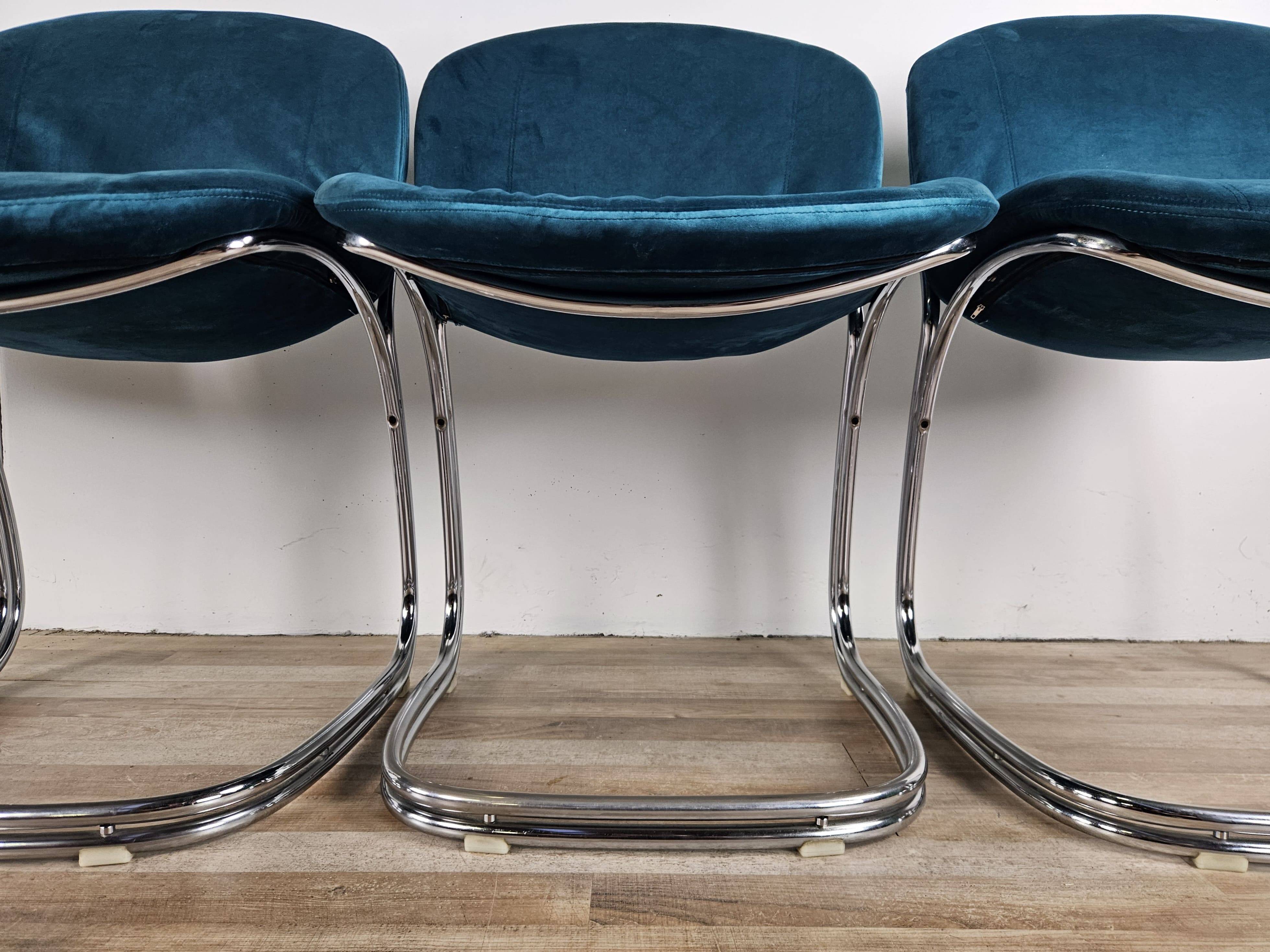 Four 1970s tubular chairs upholstered in blue velvet