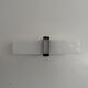 Simple white plexiglass wall light with a black metal frame, 1970s, Germany.