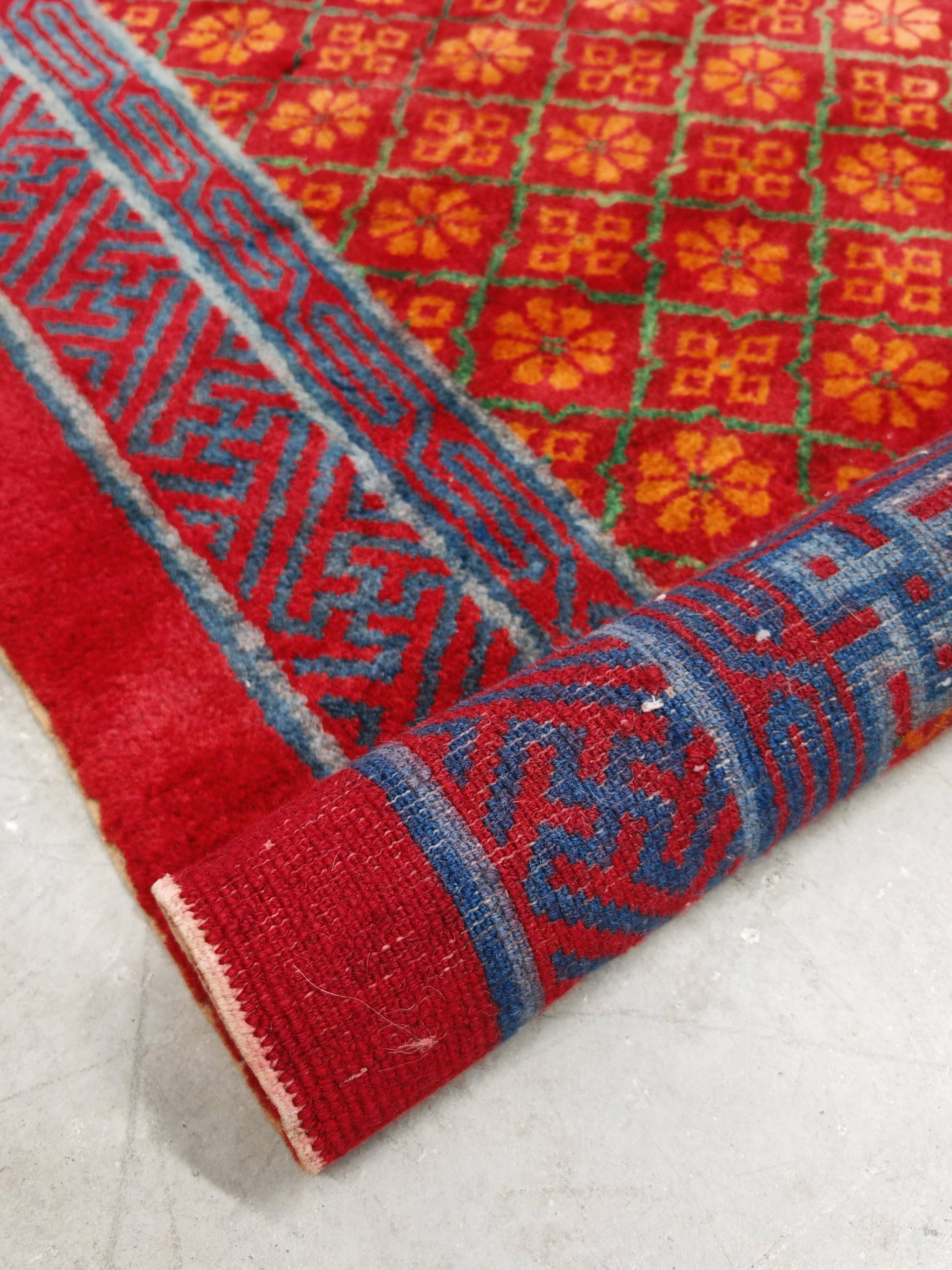 Ancient Khotan carpet, hand-knotted, floral pattern, Turkestan, 1960s.