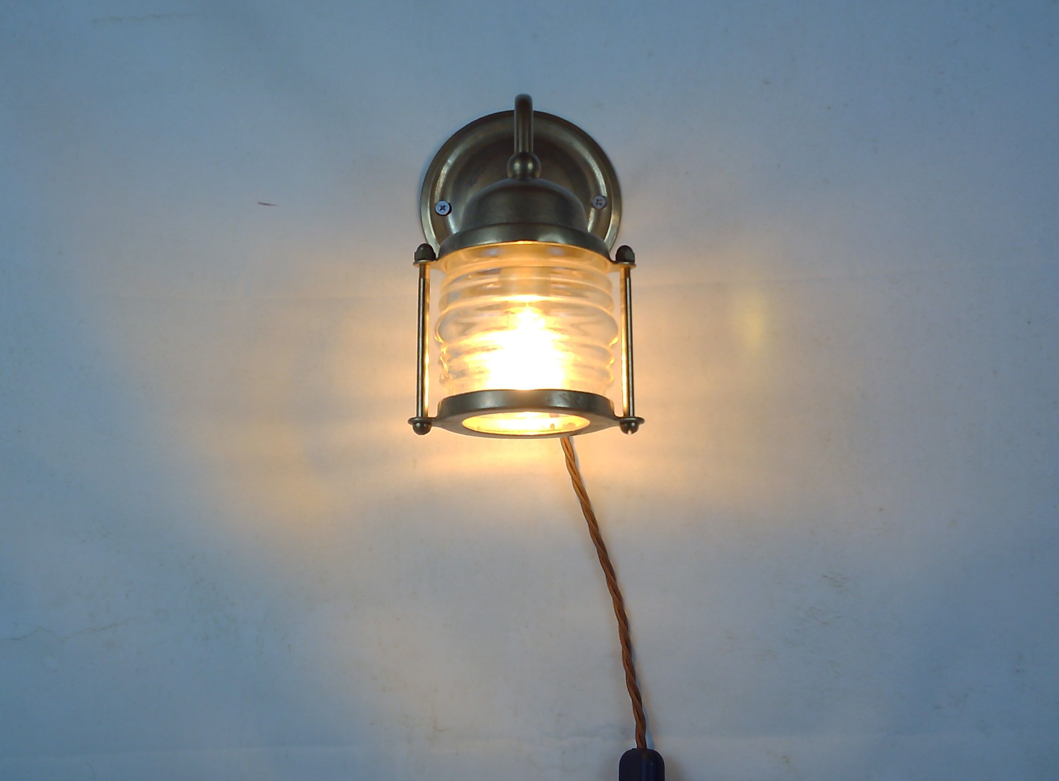 Vintage wallmounted brass lamp from a ship.