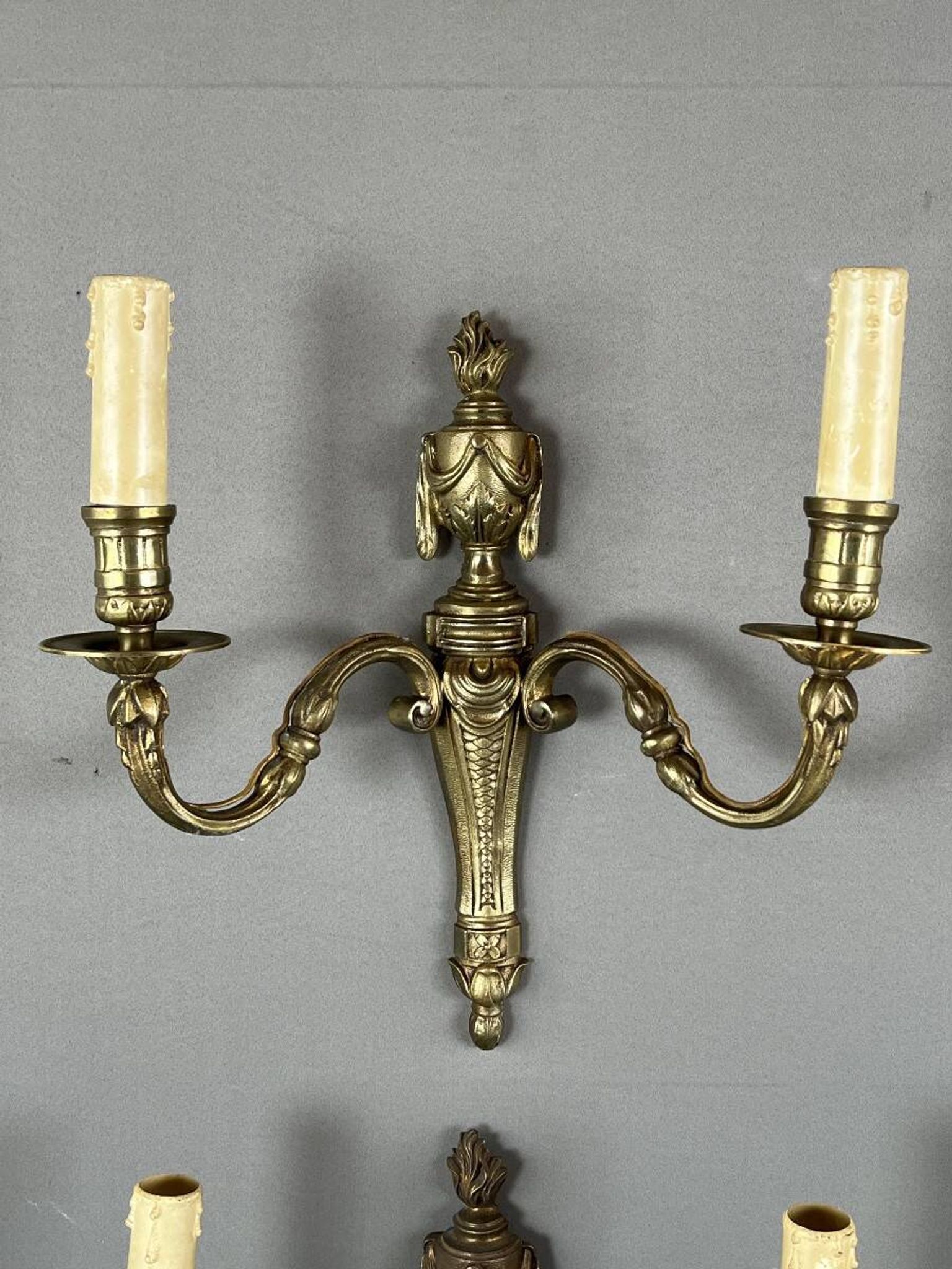 Set of four bronze wall sconces, Louis XVI style, 20th century.
