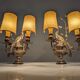 Pair of wall sconces with parrots and leaves