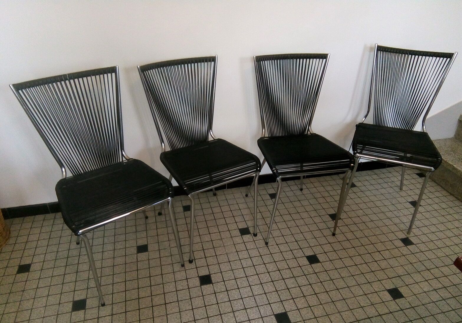 Set of black scoubidou chairs