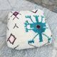 Berber floor pouf: Handwoven Moroccan wool cushion.