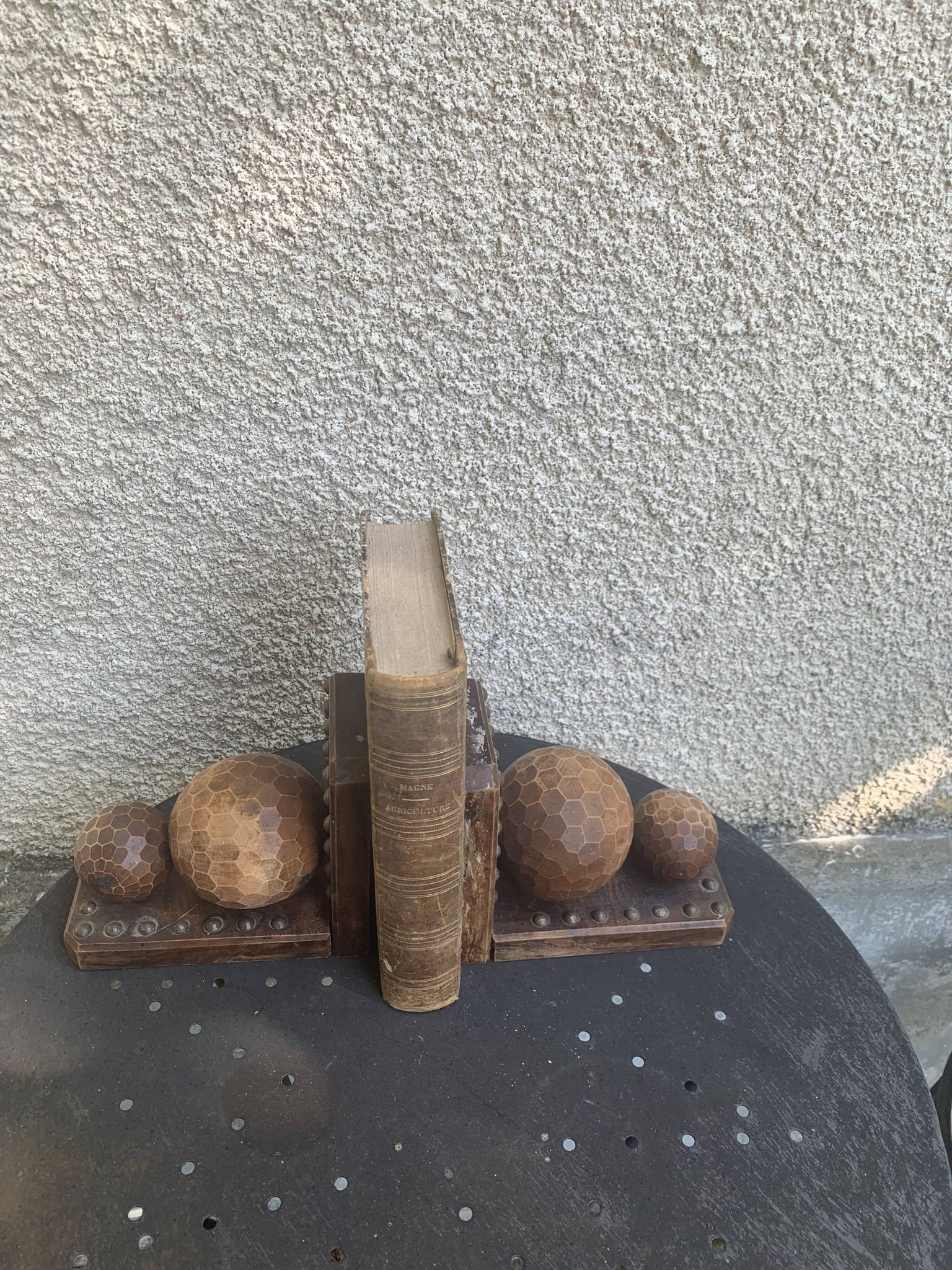 Pair of vintage carved wood and metal ball bookends