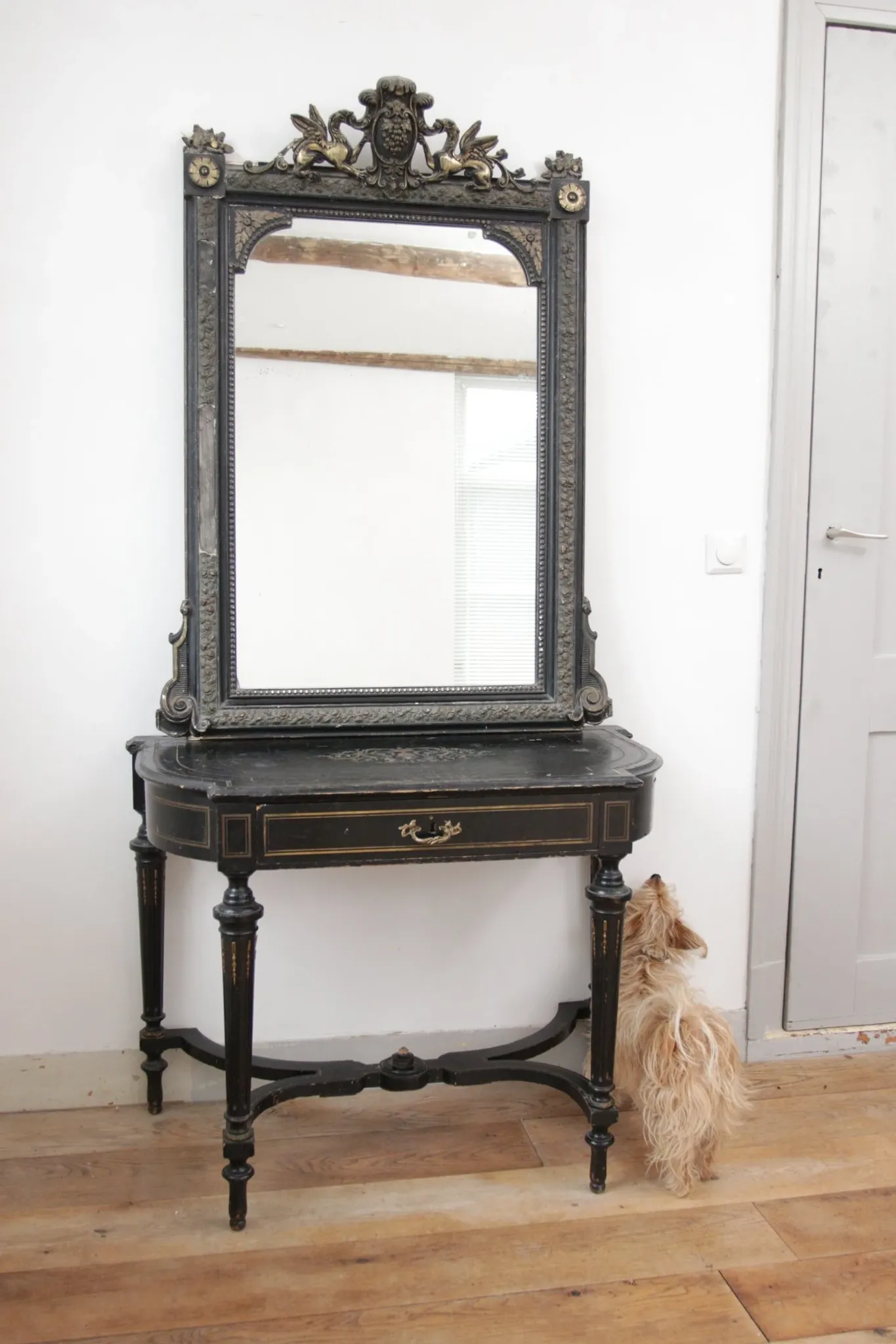 Antique 19th-century mirror with griffins and console table