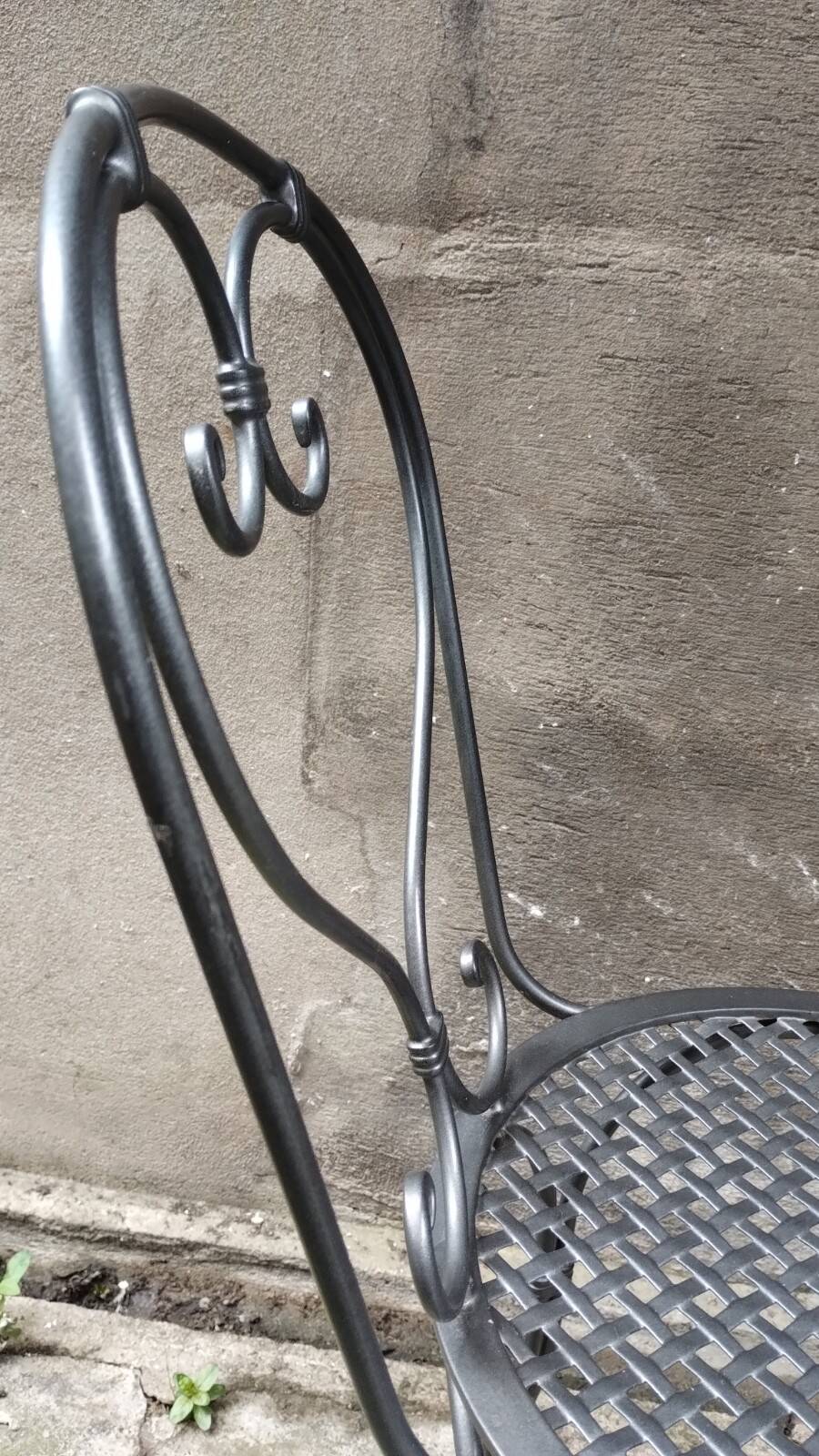 Dark gray wrought iron chair