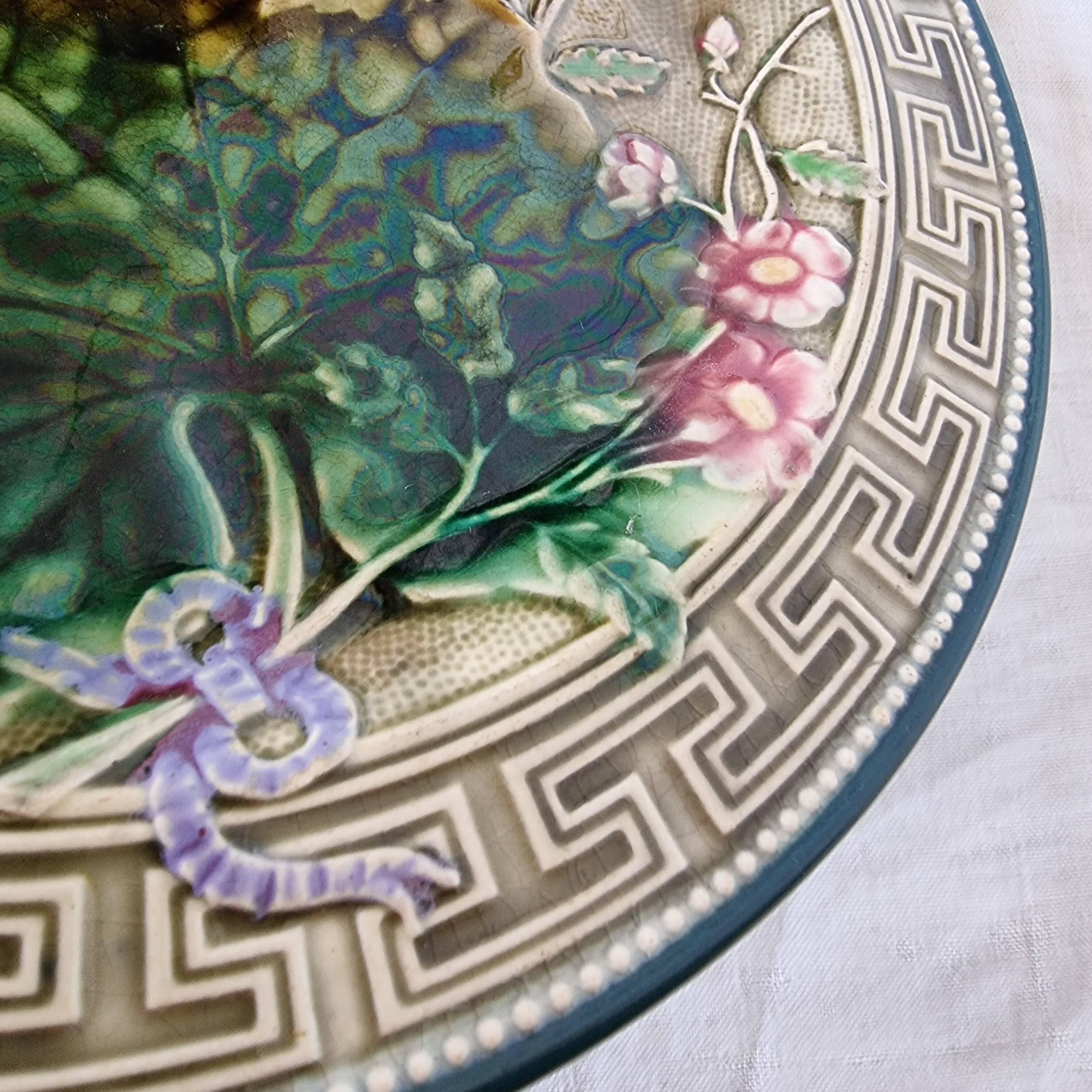 Choisy Le Roi majolica or barbotine dish decorated with leaves and pink flowers from the 19th century