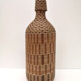Vintage bottle in braided straw