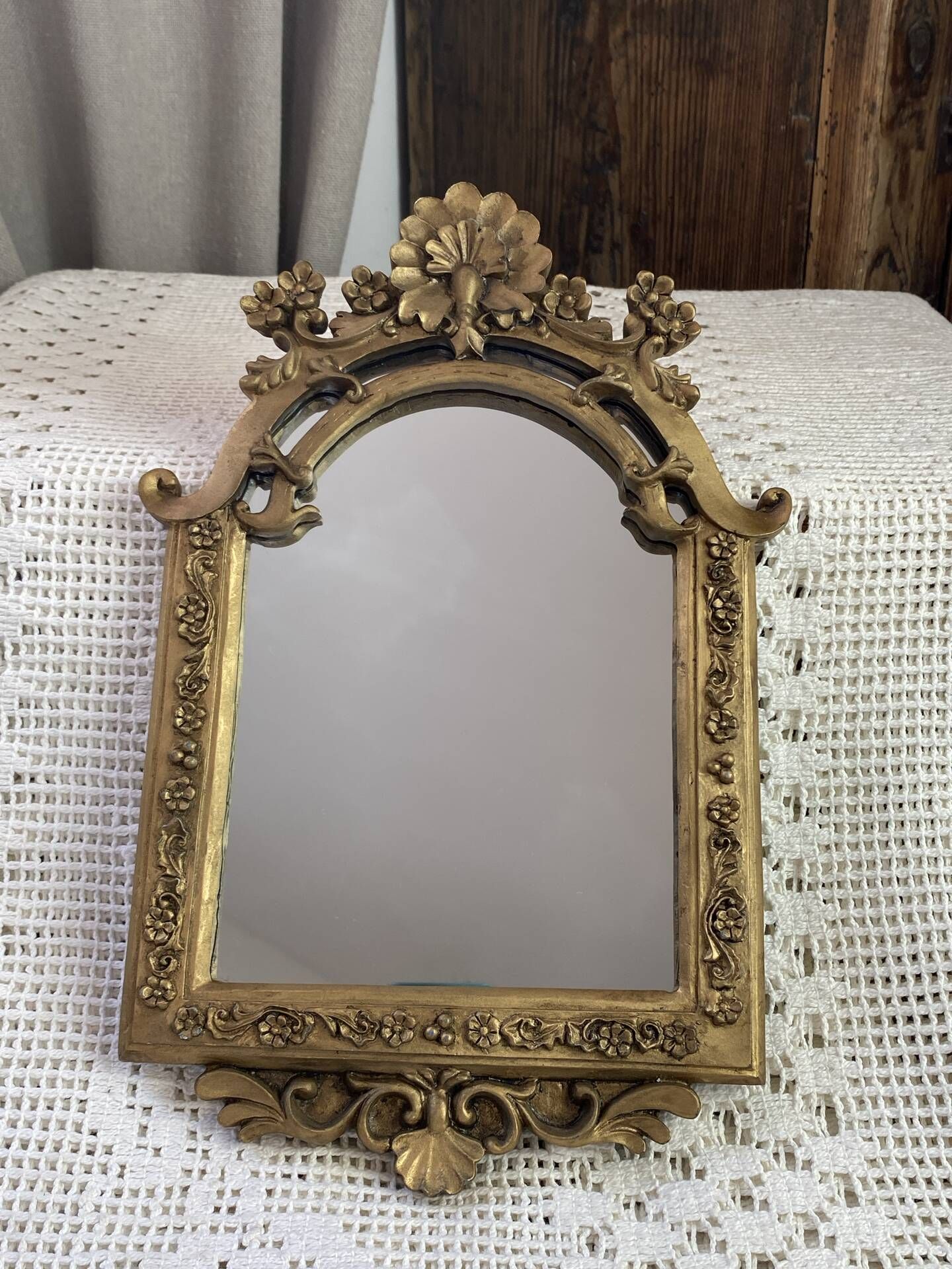 Baroque style mirror, decorated with shells and flowers.