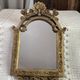 Baroque style mirror, decorated with shells and flowers.