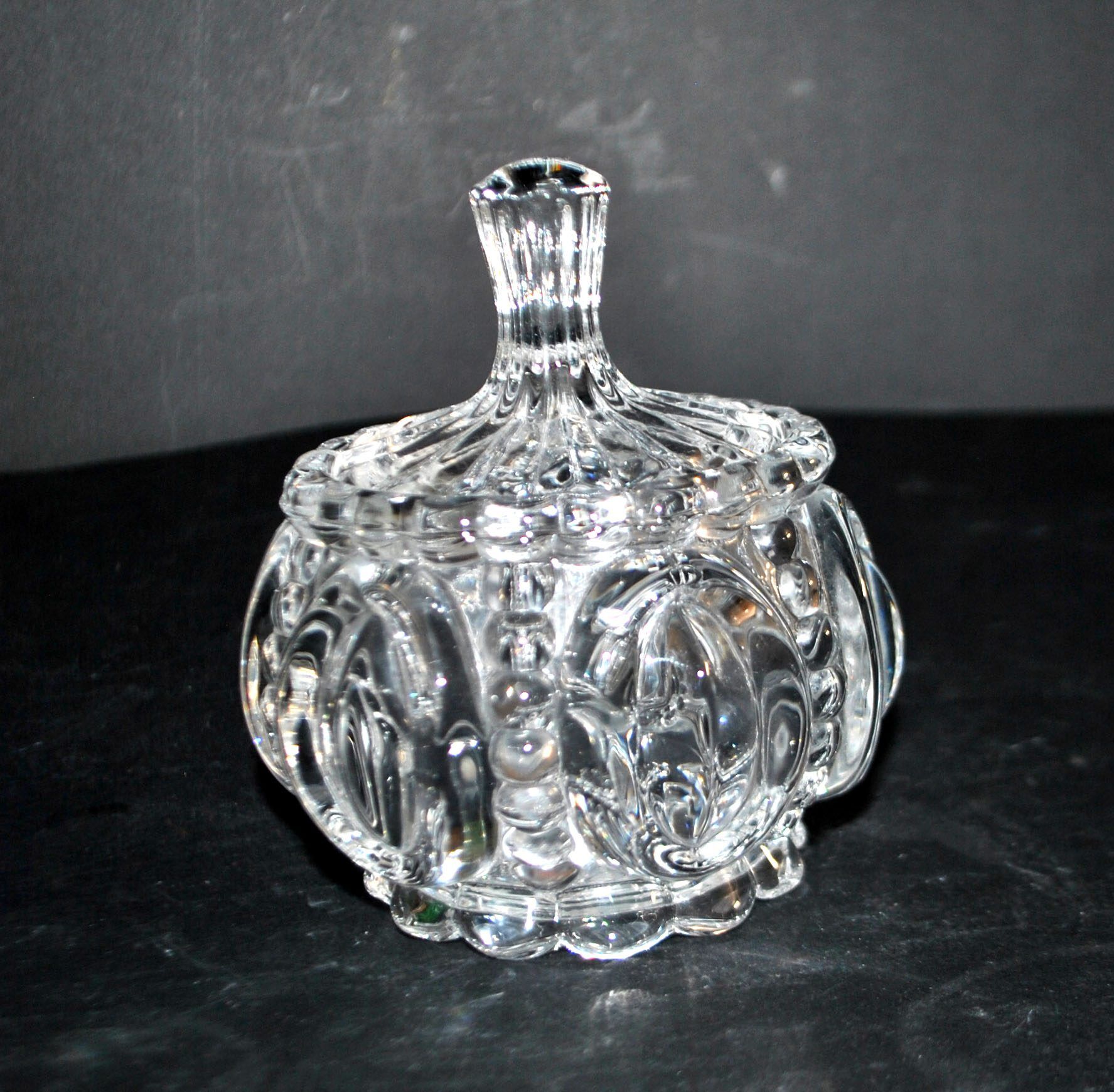 Thick moulded crystal sugar bowl with a beaded and medallion design.