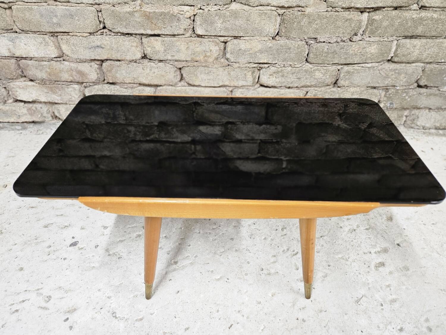 Small opaque black glass coffee table 1960