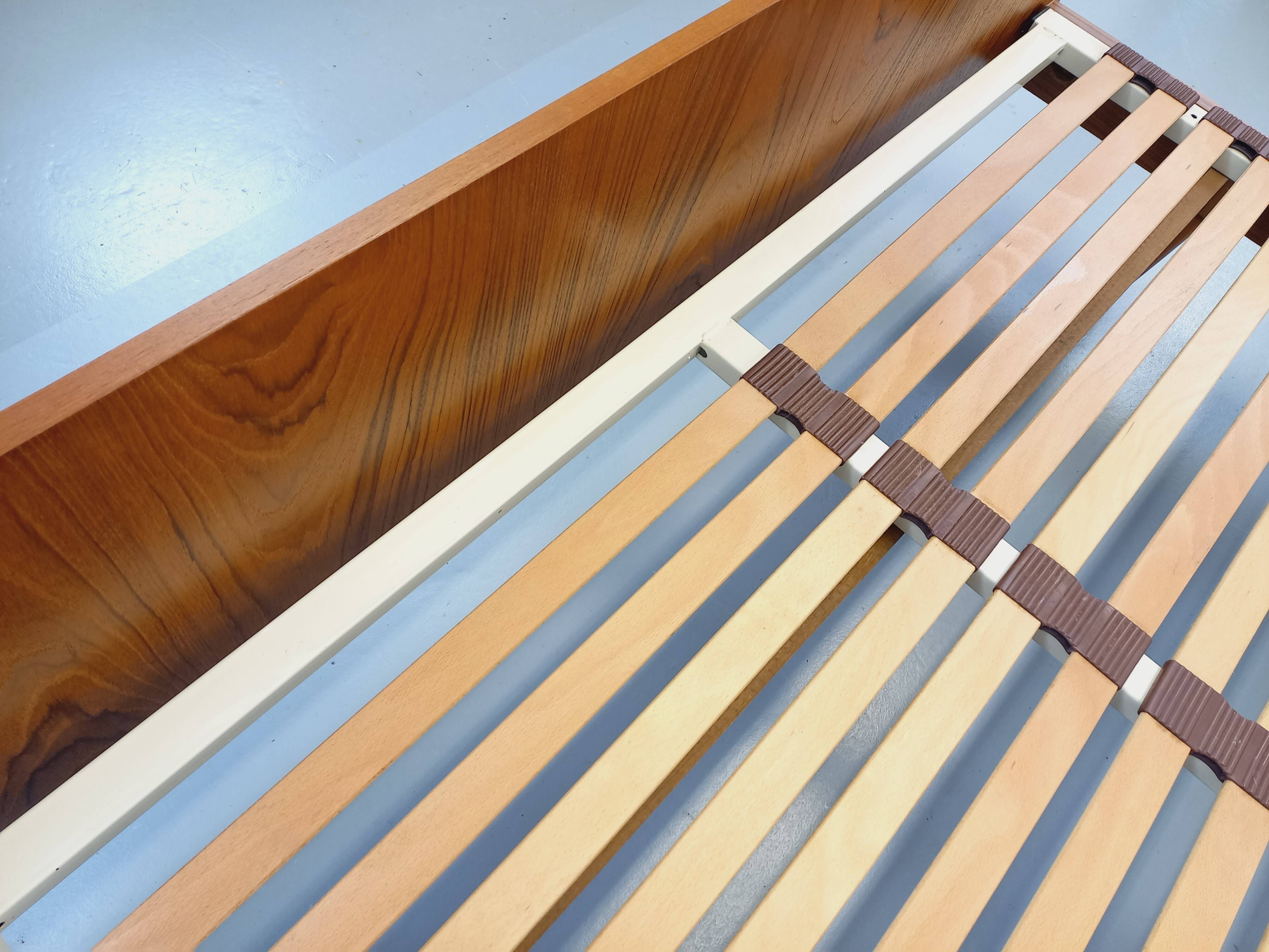 Double bed in vintage Scandinavian style from the 1960s with bedside tables in teak.