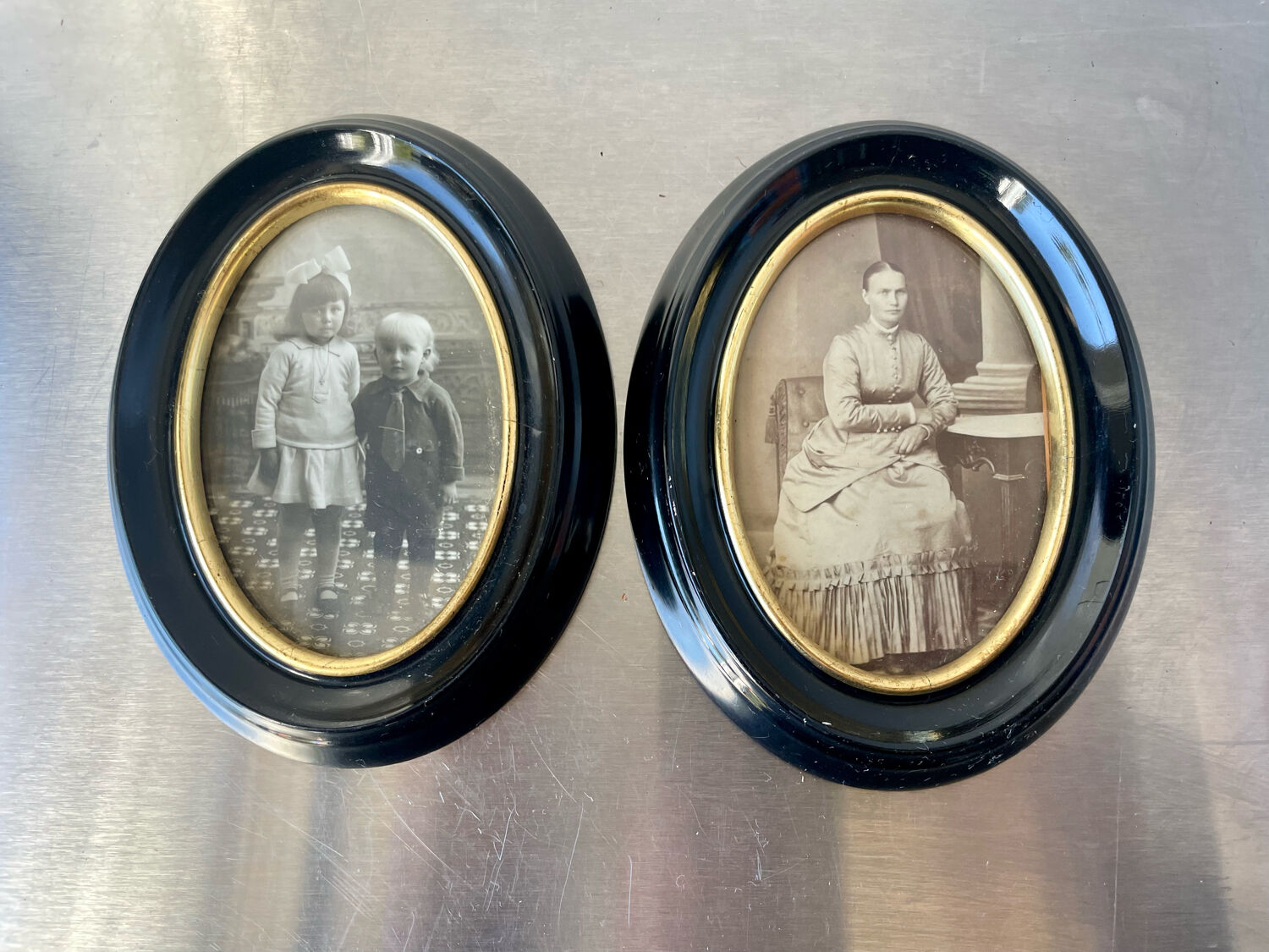 Pair of black wooden oval frames 1880’s  each 13 cm x 10 cm glass measurements 8.5 cm x 5.5 cm