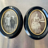 Pair of black wooden oval frames 1880’s  each 13 cm x 10 cm glass measurements 8.5 cm x 5.5 cm