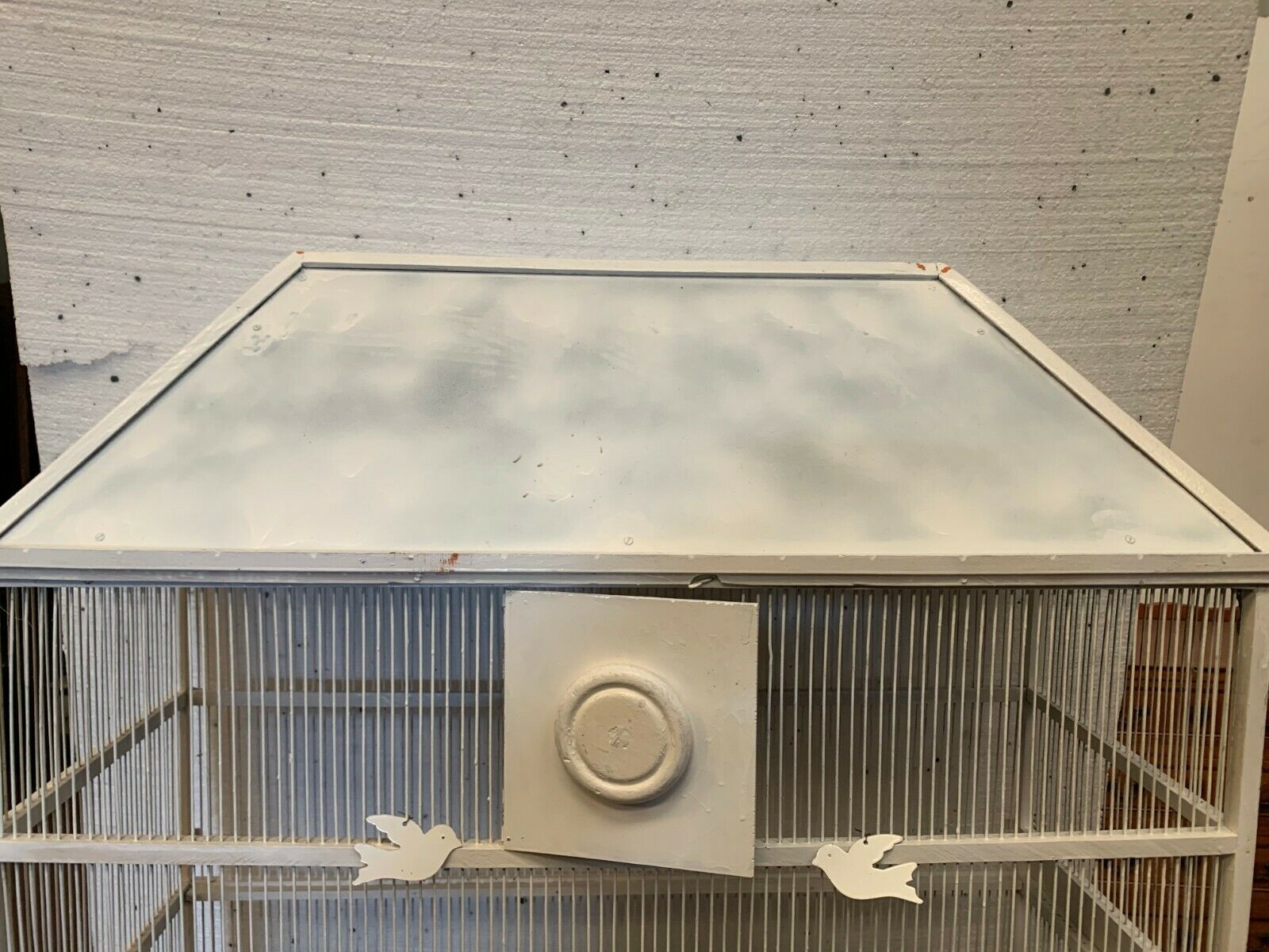 Cage has iron birds and prison volière has 20th century bars