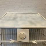 Cage has iron birds and prison volière has 20th century bars