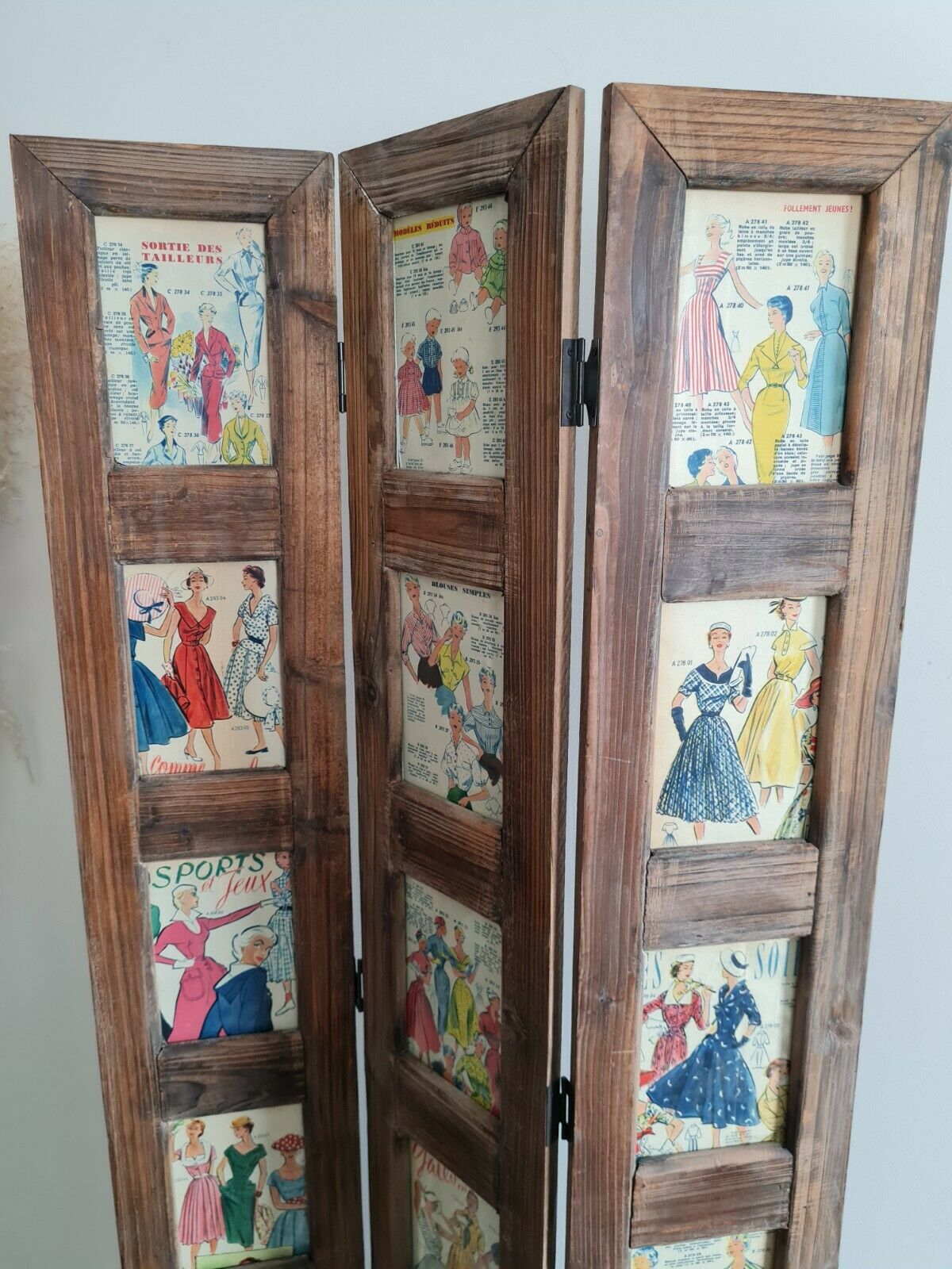 Wooden screen with vintage haute couture images or for photos