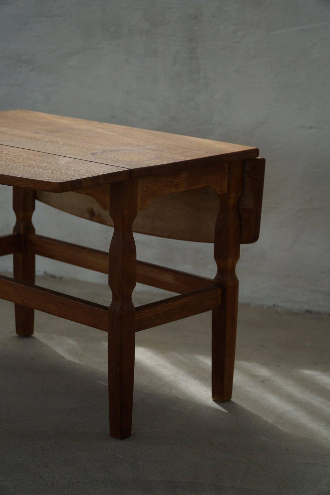 Modern Danish folding side table in solid oak, mid-20th century.