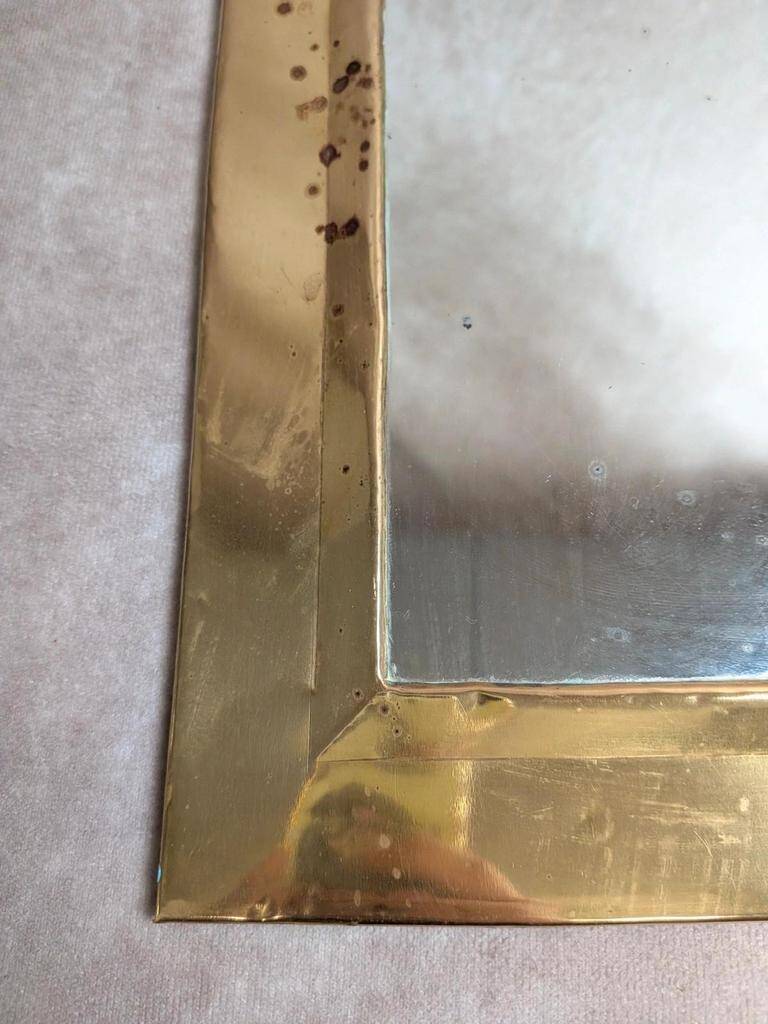 Vintage Moroccan wall mirror in brass, arch shape.