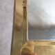 Vintage Moroccan wall mirror in brass, arch shape.