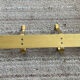 Golden wall-mounted coat rack from the 70s.
