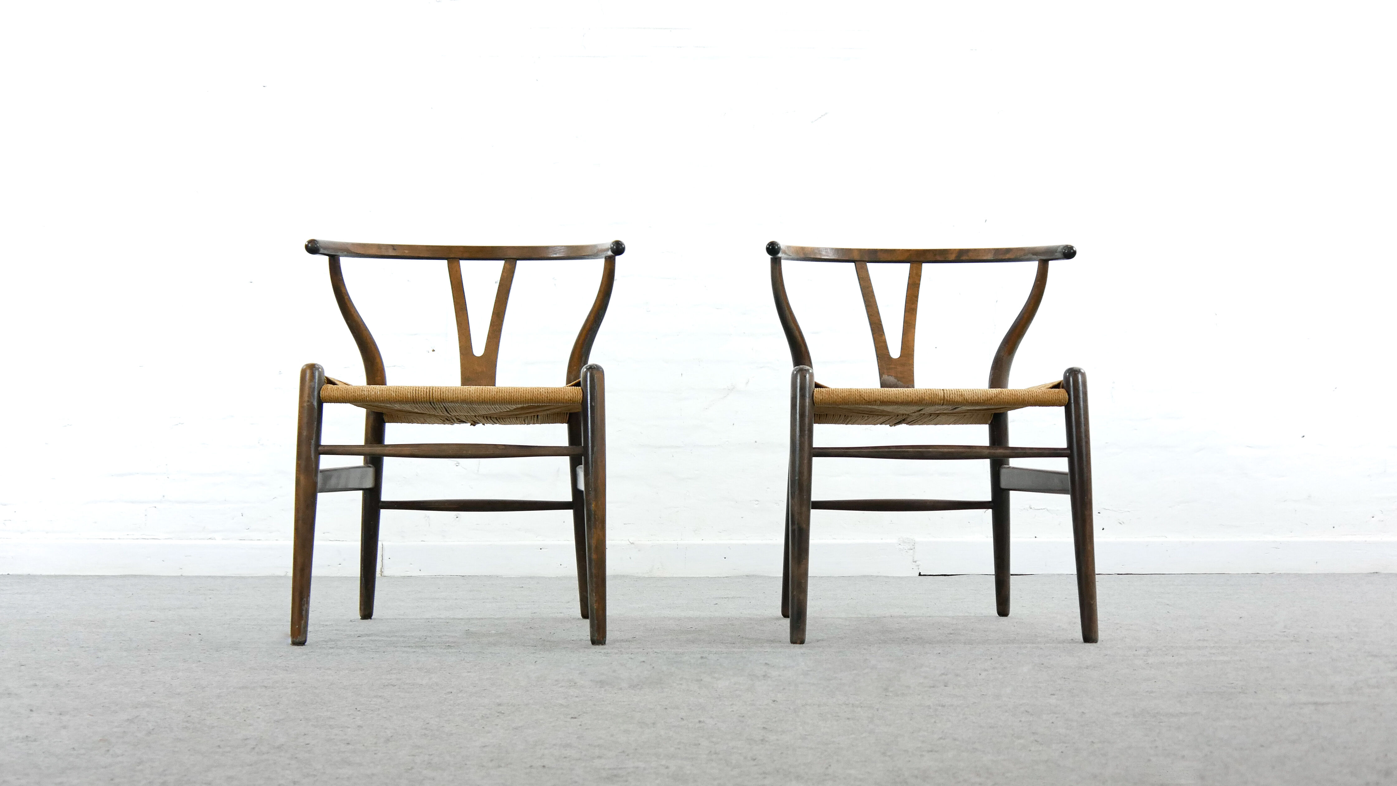 Pair of CH24 wishbone dining chairs by Hans Wegner for Carl Hansen Denmark