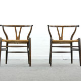 Pair of CH24 wishbone dining chairs by Hans Wegner for Carl Hansen Denmark