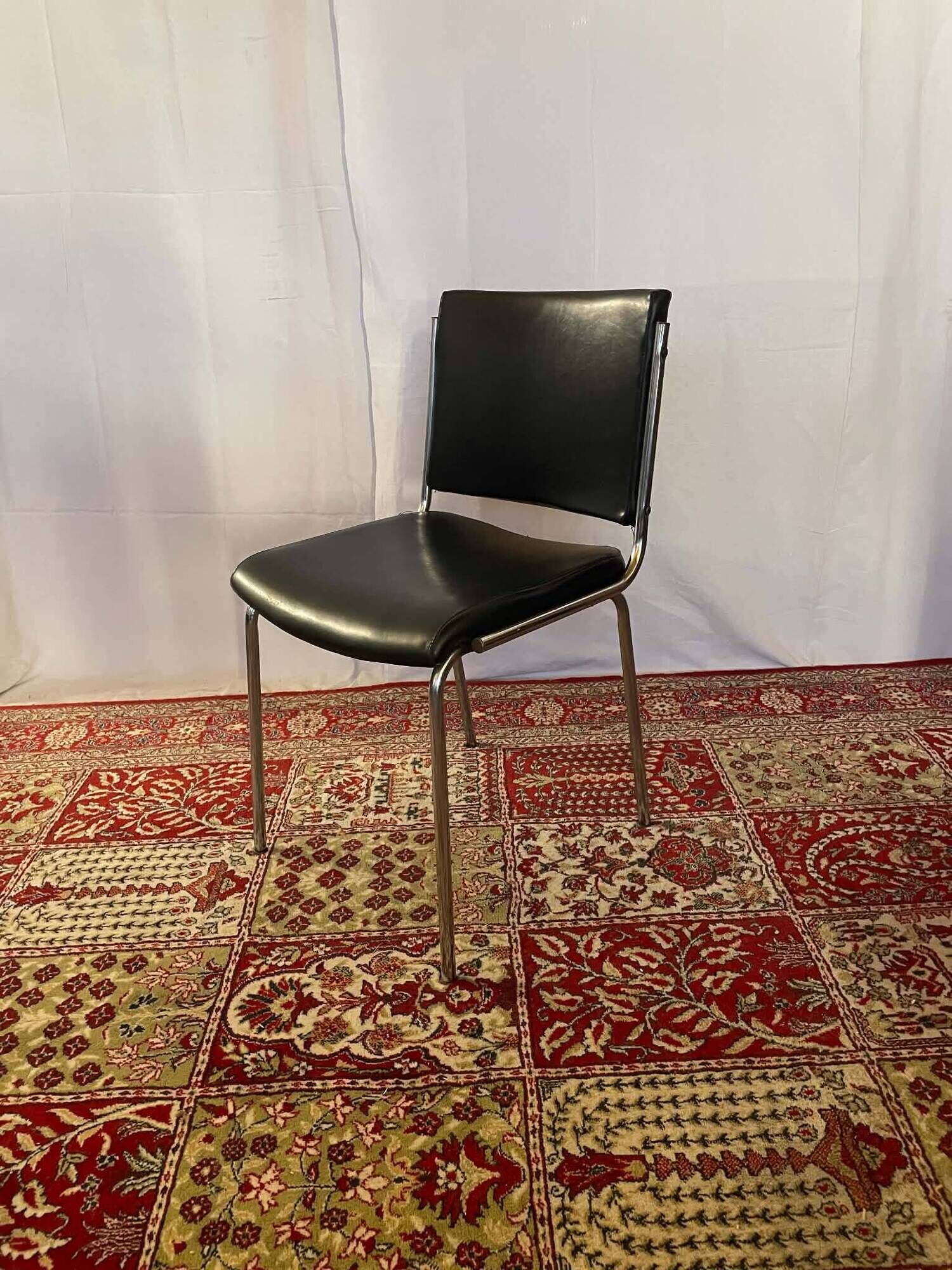 Vintage chair in black faux leather and chrome metal