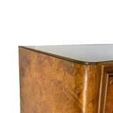 Veneered burl walnut chest of drawers with light warm brown glass top