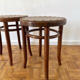 2 antique bistro stools with curved wood and caning effect.