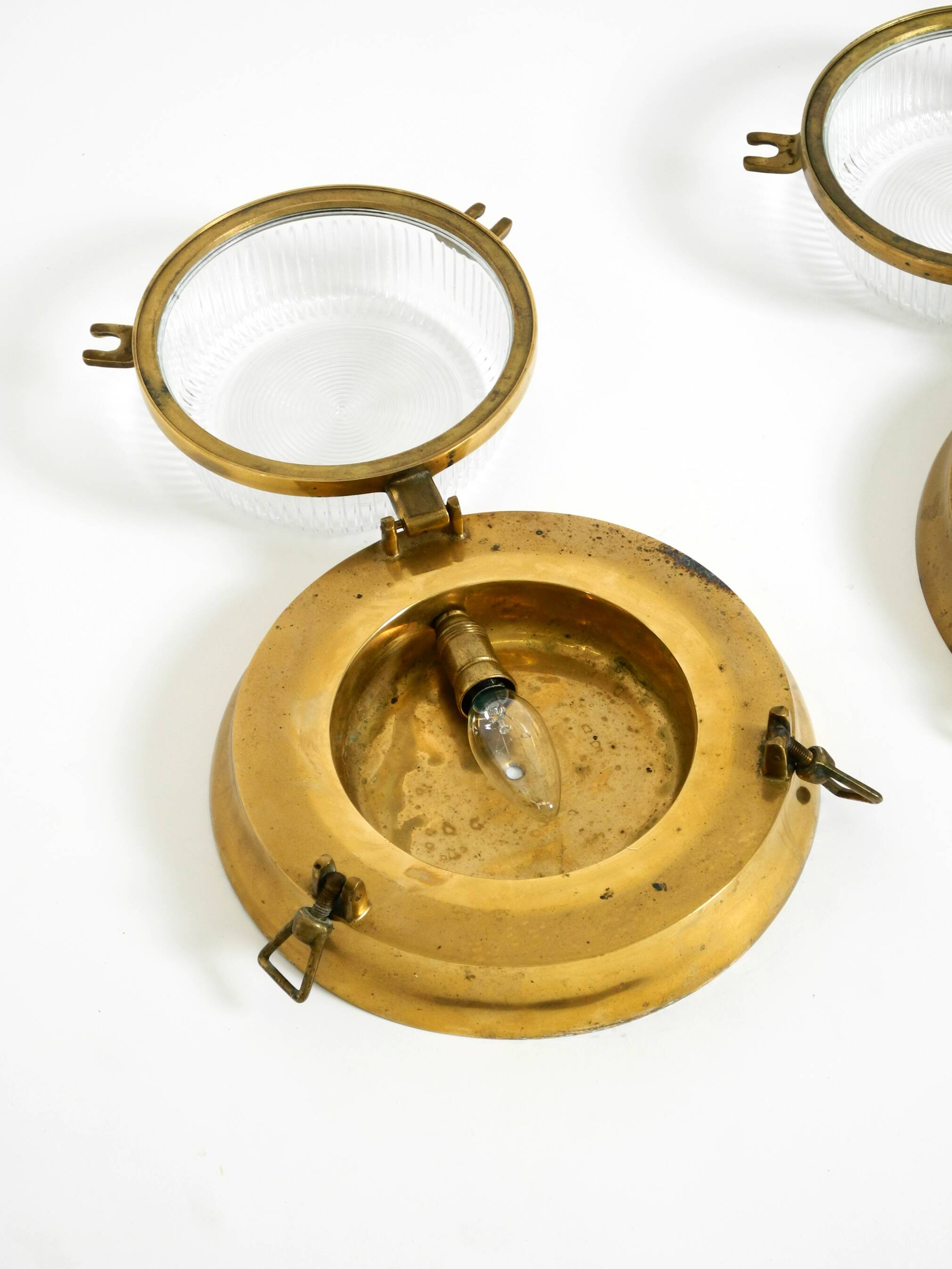 A pair of large, heavy 50s maritime ship wall lamps made of brass and glass