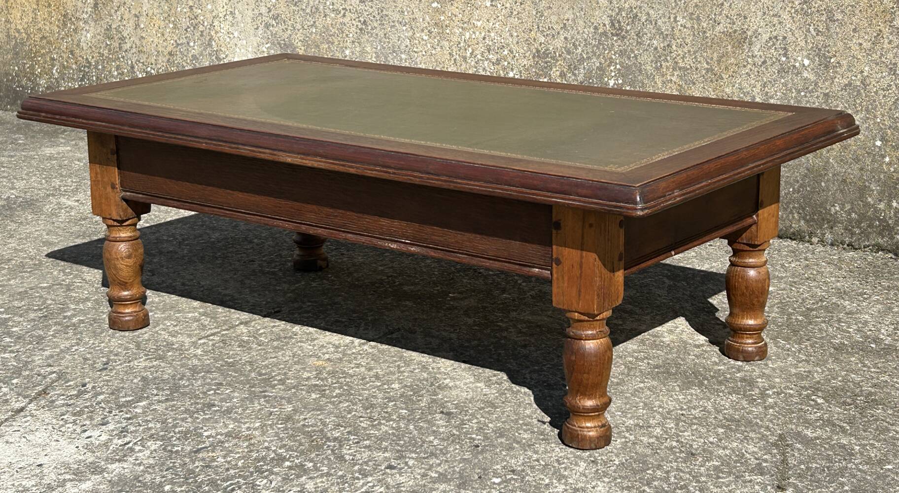 Vintage English coffee table in oak and green leather – 1950s/60s