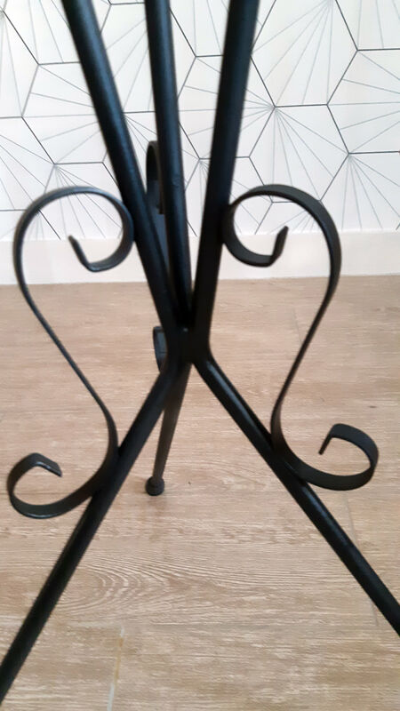 Plant holder in black wrought iron.