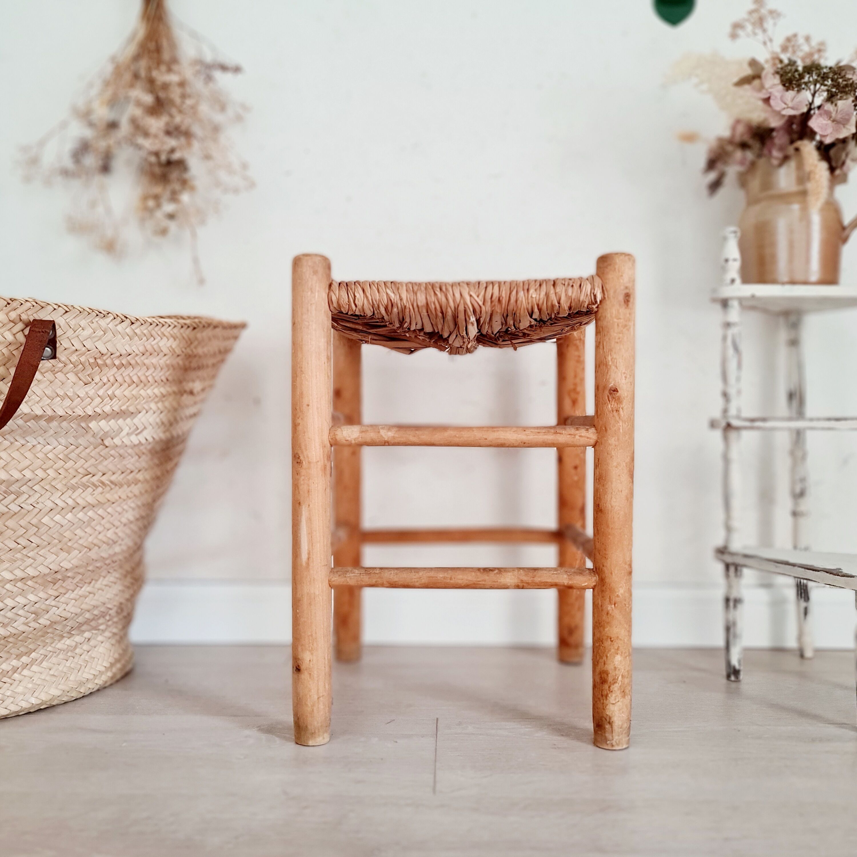 Old stool in wood and straw brutalist look